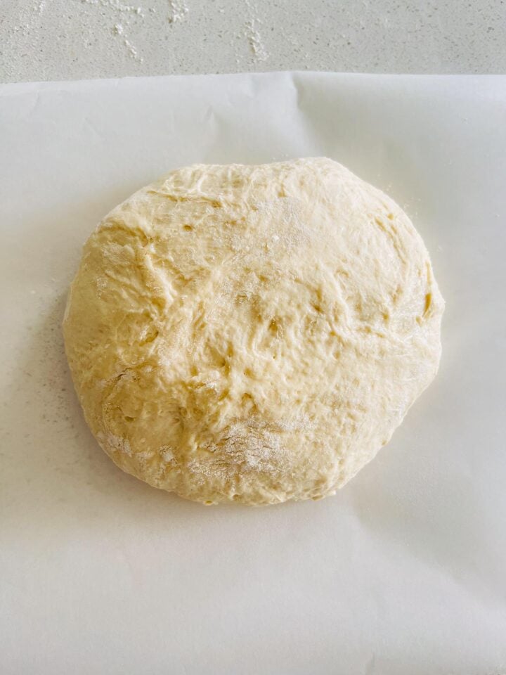 Shaped dough on a parchment paper for second rise.