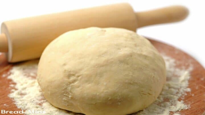Well kneaded dough on a wooden surface.
